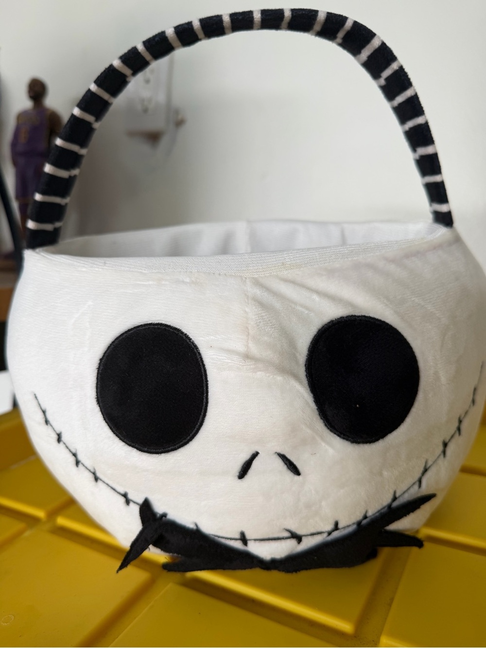 Spirit Plush White Jack Skellington Treat Basket with Black Striped Handle
